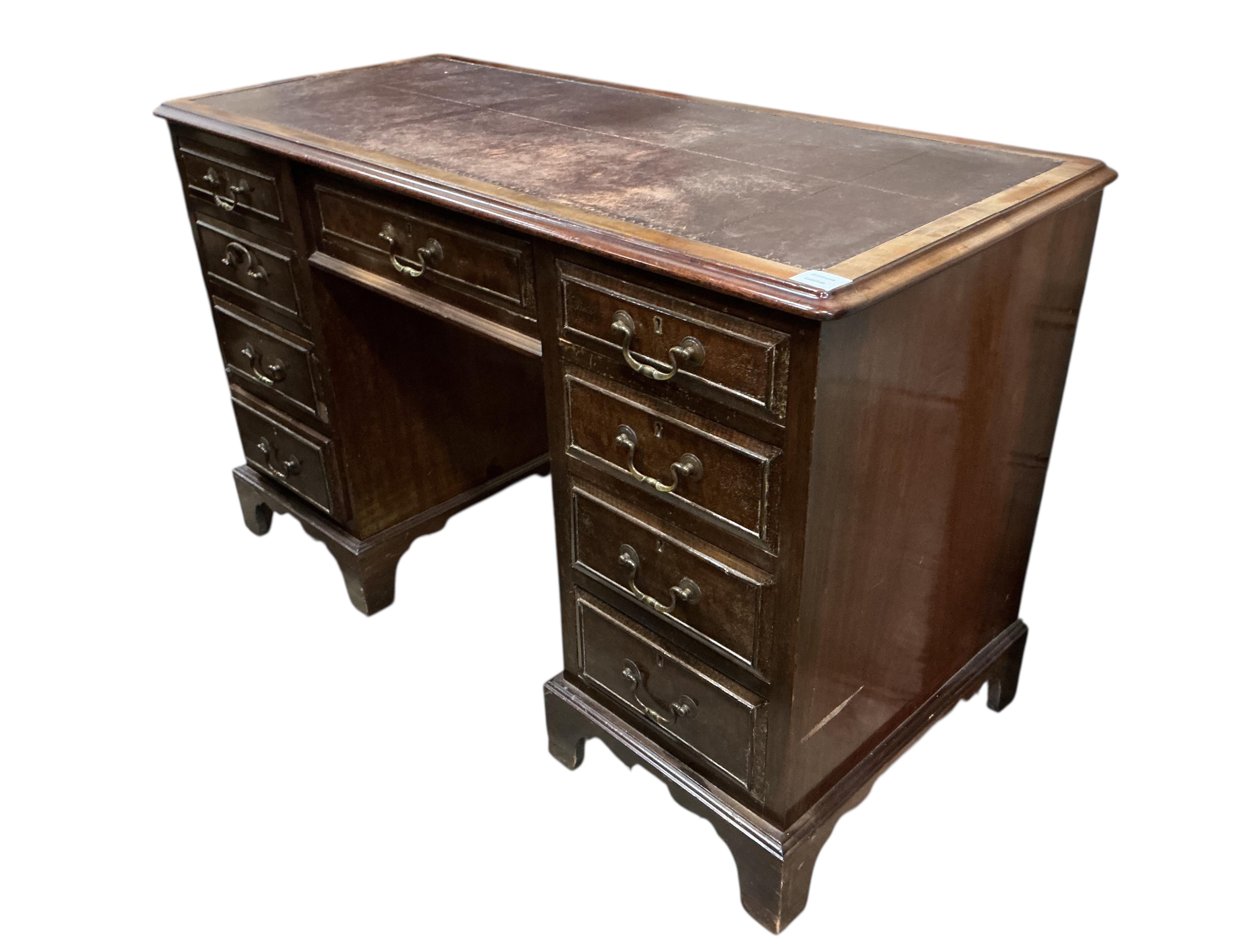 An early 20th century mahogany kneehole desk, width 121cm, depth 55cm, height 75cm